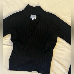 Black sweater turtleneck with cutout
